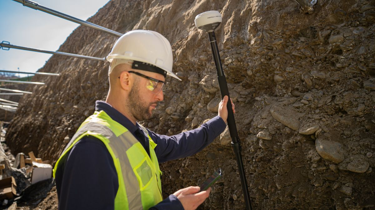 Emlid Reach RS4 Pro receiver in use inside a trench
